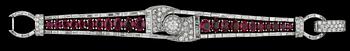 ARMBAND, fasettslipade Burma rubiner, tot. ca 12.20 ct, briljant- och baguetteslipade diamanter, tot. ca 14 ct. 1940-tal.