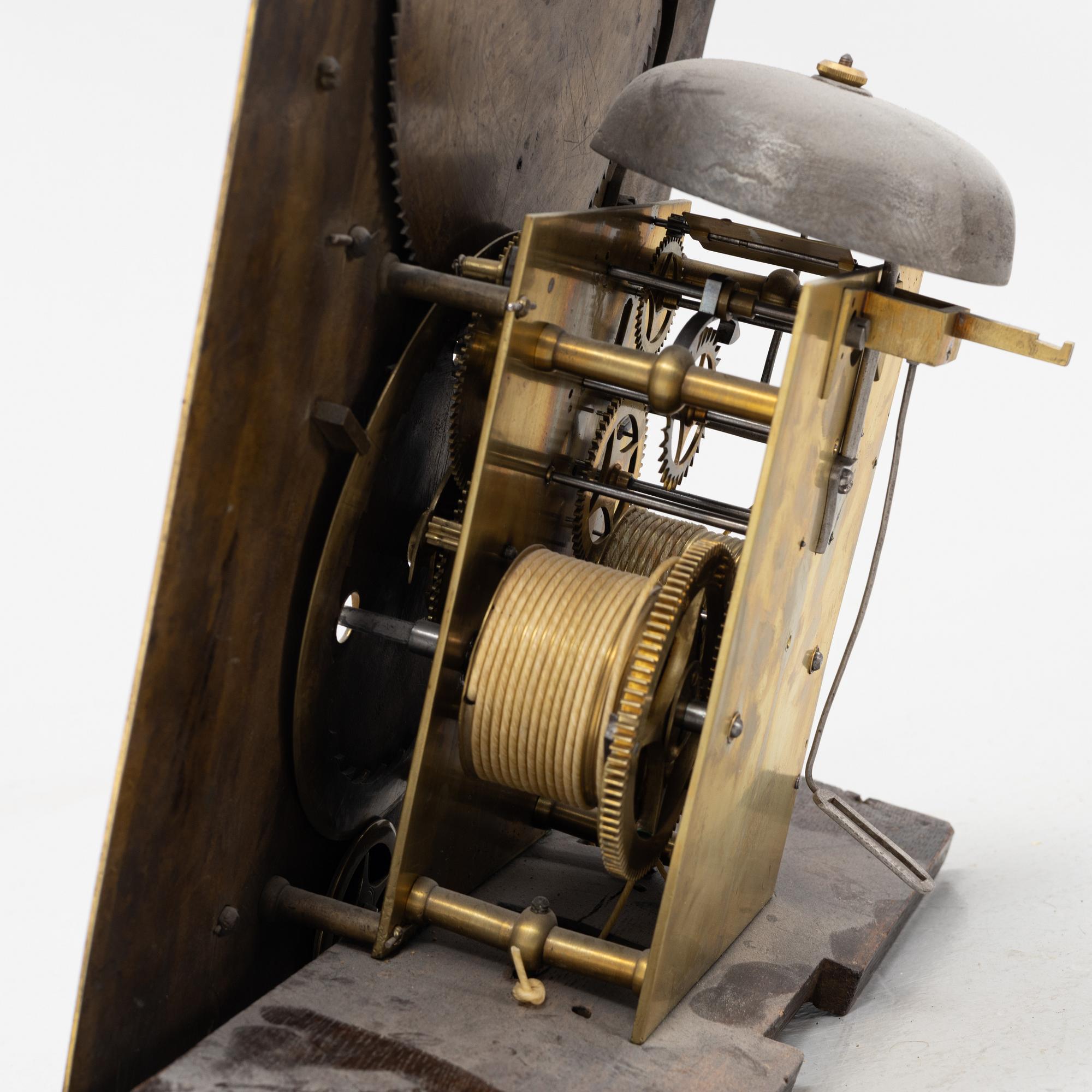 A mahogany veneered longcase clock, marked Peter Pohlmann, London, England, 18th century.