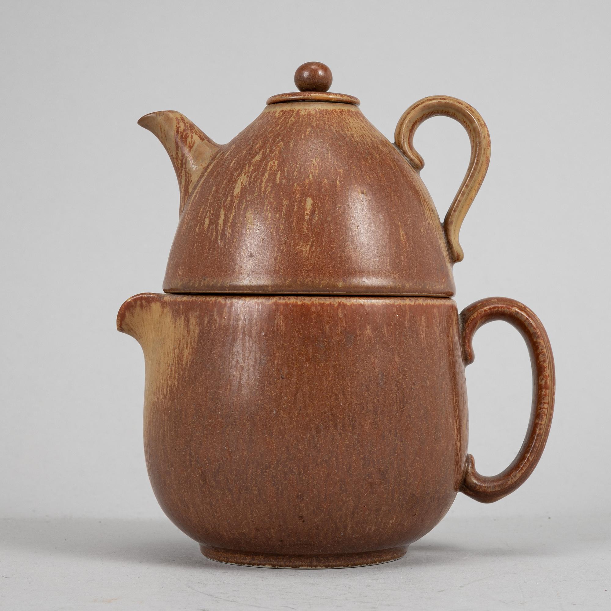 Tea pot, two bowls, two creamers, and a vase by Gunnar Nylund, stoneware, Rörstrand.