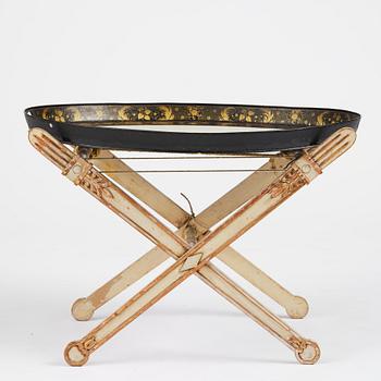 A tole-peinte Empire tray, first part 19th century on a later stand.