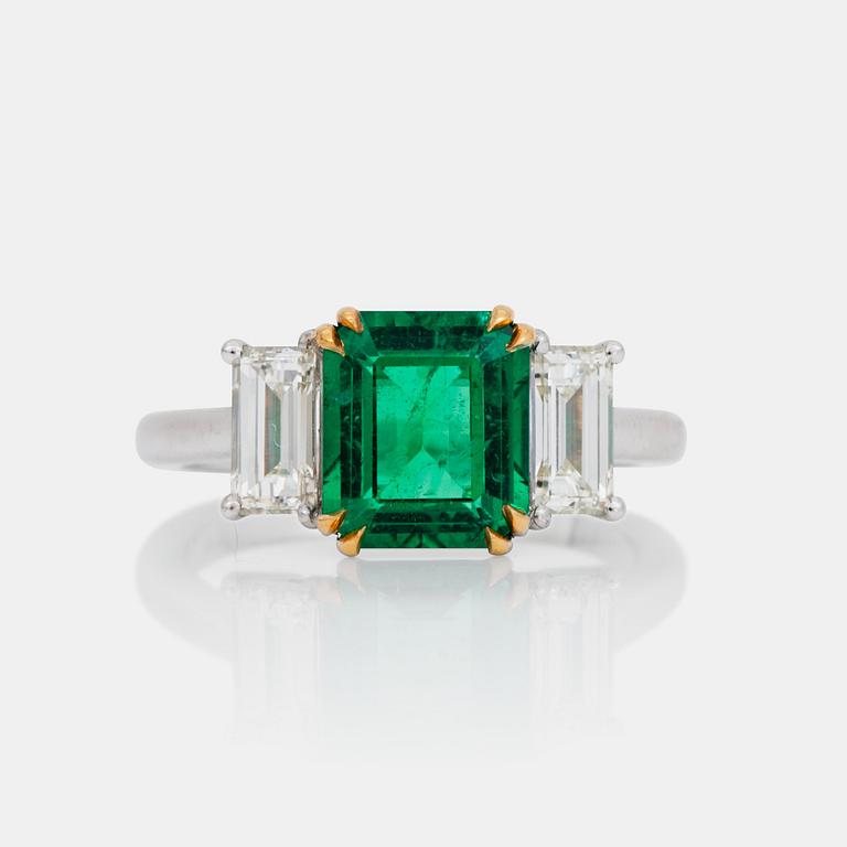 A 2.37 ct step-cut emerald and baguette-cut diamond ring. Total carat weight of diamonds circa 1.00 ct.