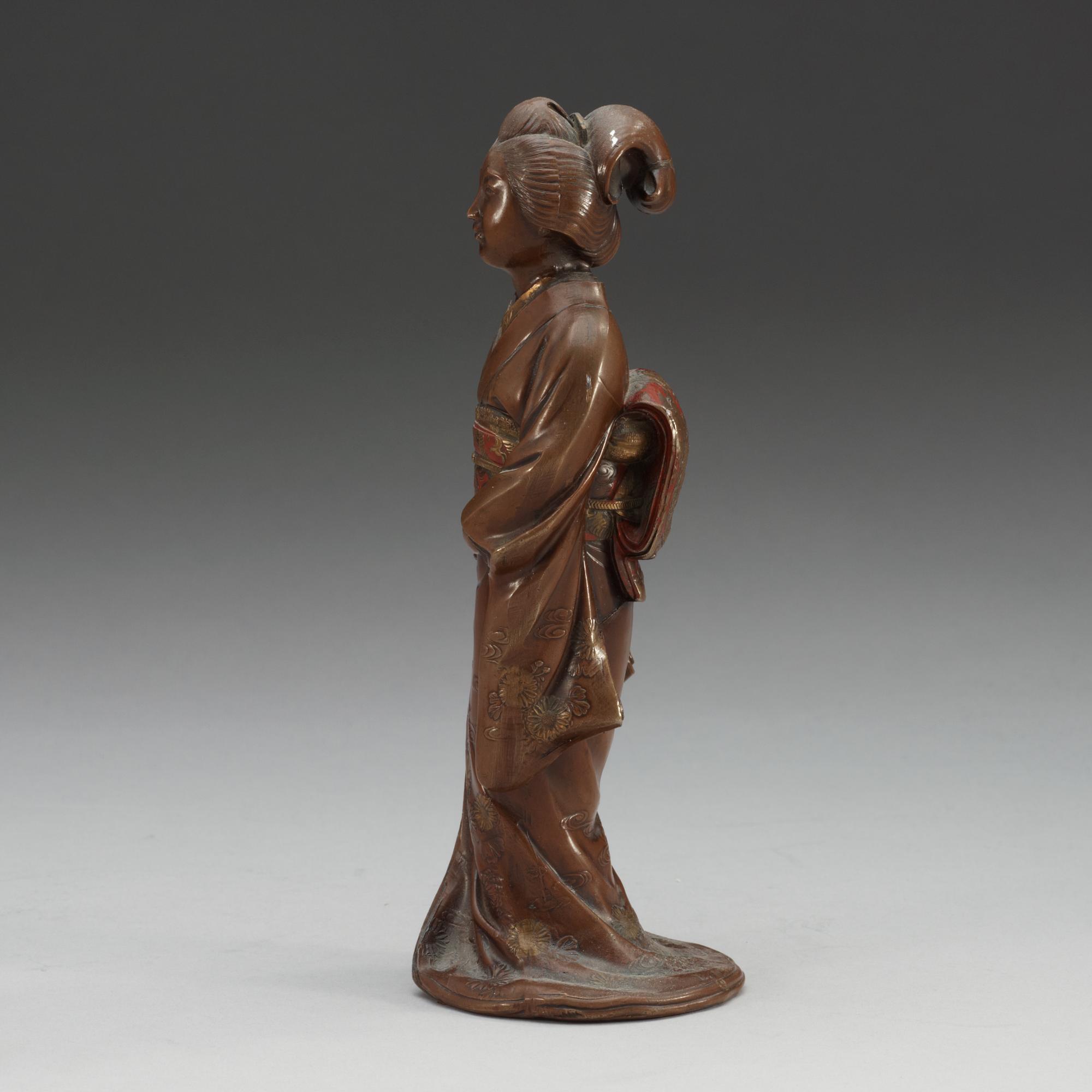 A Japanese gilt and lacquered bronze figure of a court lady, Meiji, ca 1900.