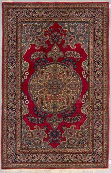 A RUG, a semi-antique Kerman, ca 220,5 x 139,5-142,5 cm.