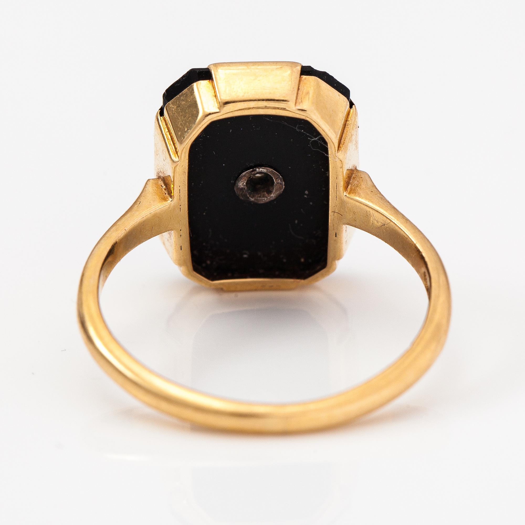 An 1(K gold ring with an onyx and an old-cut diamond ca. 0.18 ct. Westerback, Helsinki 1938.