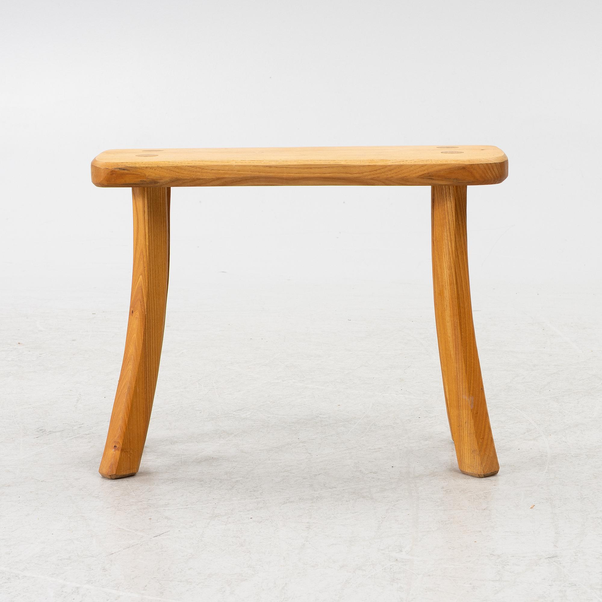 A solid pine stool, signed RO -99, Sweden.