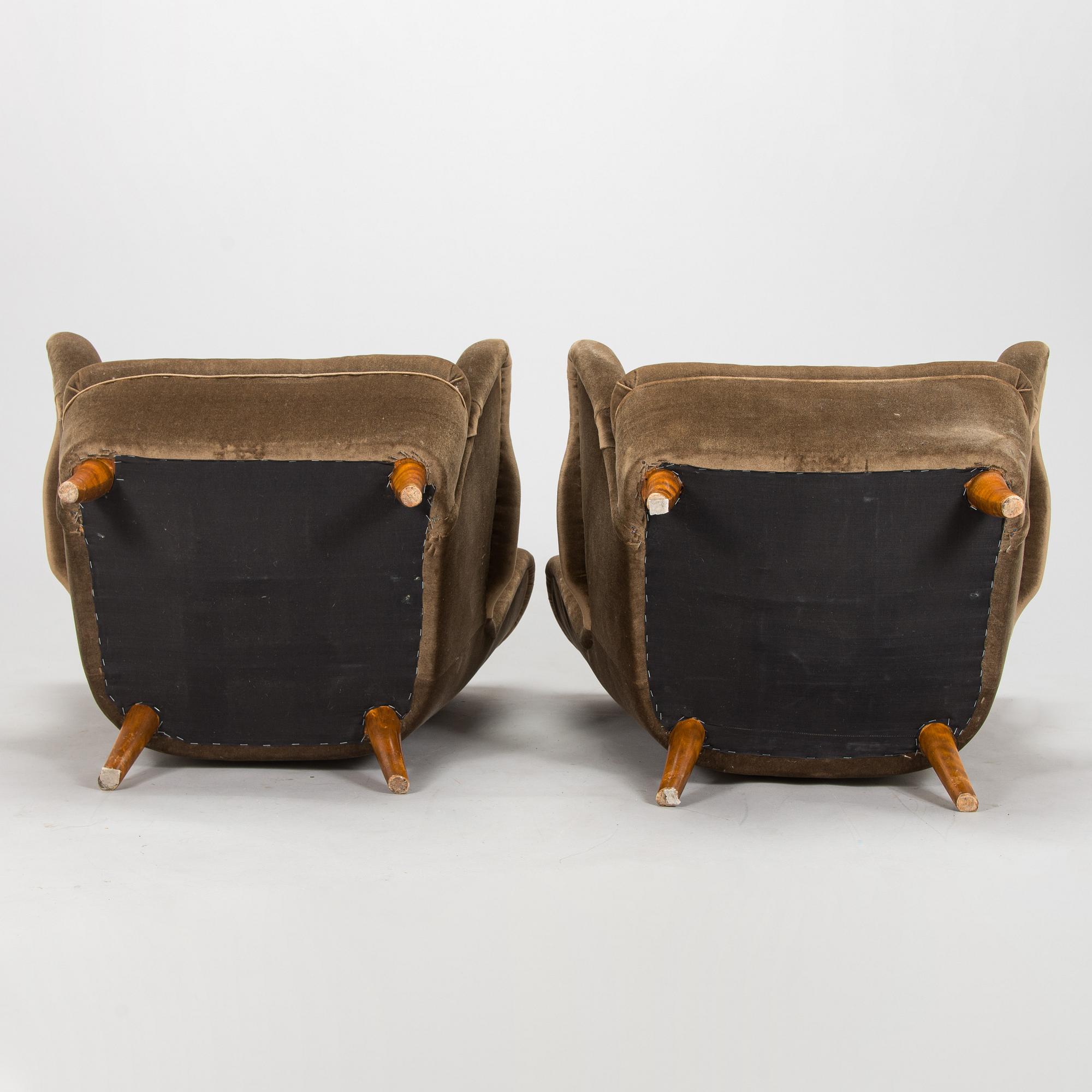 A pair of mid-20th century armchairs.