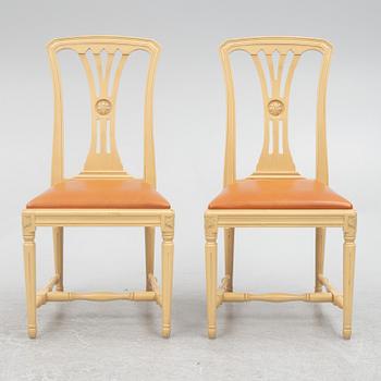 A Gustavian style dining table with six dining chairs, Sweden, 21st century.