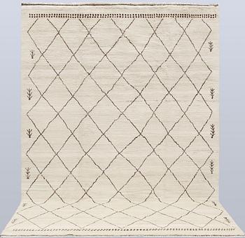 A Moroccan rug, c. 290 x 197 cm.