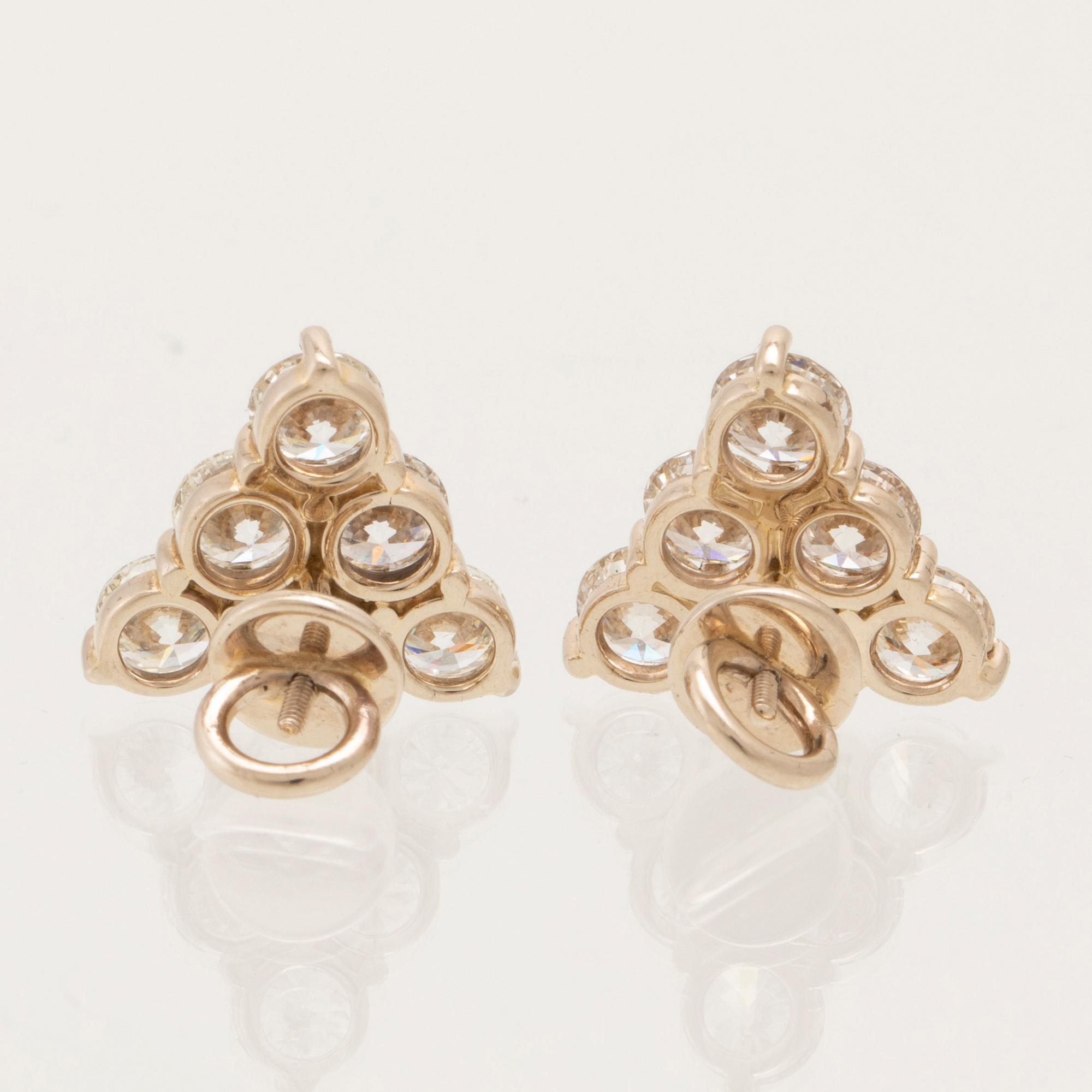Earrings, a pair of 18K white gold with round brilliant-cut diamonds.