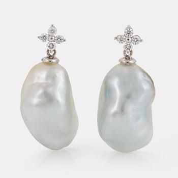 1004. A pair of cultured South Sea pearl earrings in 18K white gold set with round brilliant-cut diamonds.