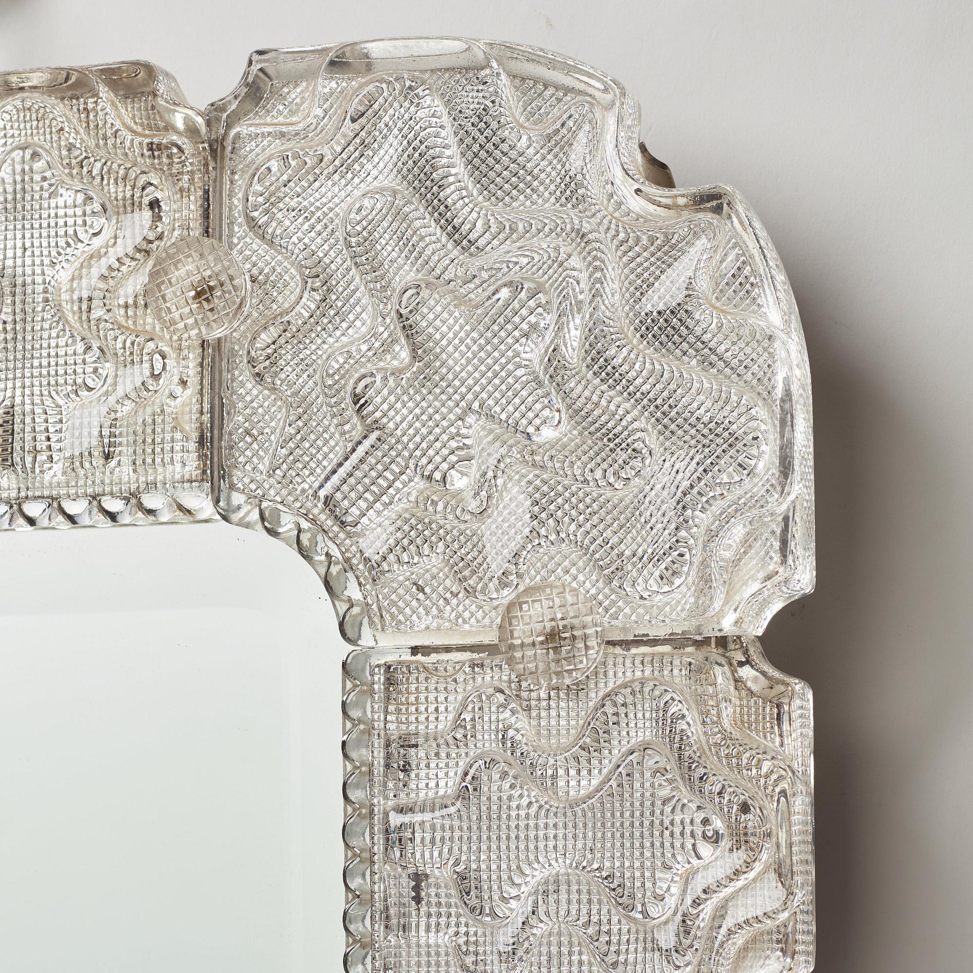 Carl Fagerlund, a Swedish Modern cast glass framed mirror, Orrefors 1940-50's.
