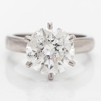 A platinum ring, with a brilliant-cut diamond approximately 3.10 ct. Domino Jewellery, Birmingham, England.