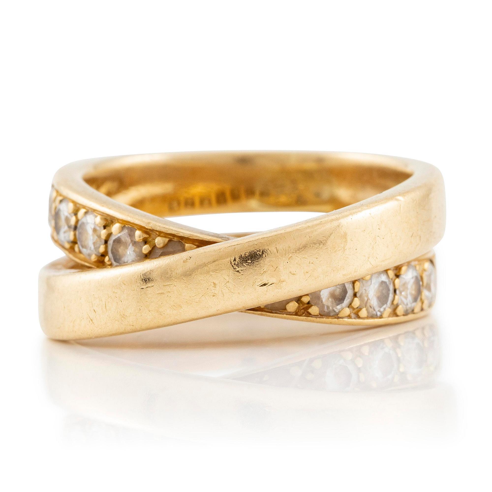 A Cartier ring, "Nouvelle Vague", 18K gold with round brilliant-cut diamonds.