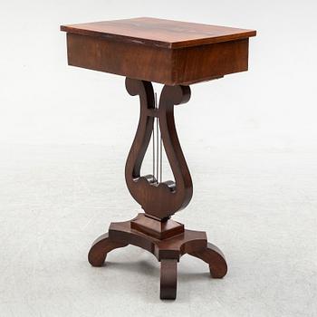 An early 20th century sewing table.