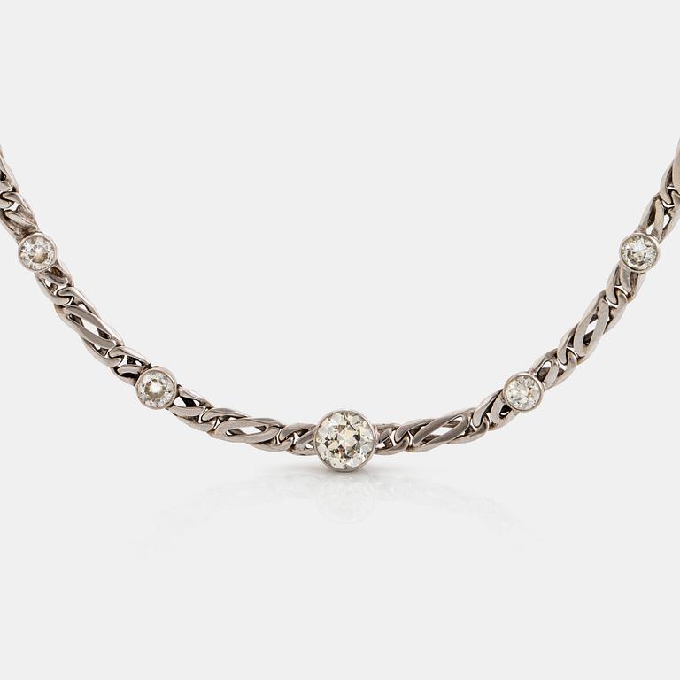 An 18K white gold necklace/bracelet combination set with round brilliant-cut diamonds.