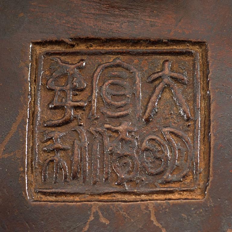 A bronze tripod censer, Ming dynasty (1368-1644).