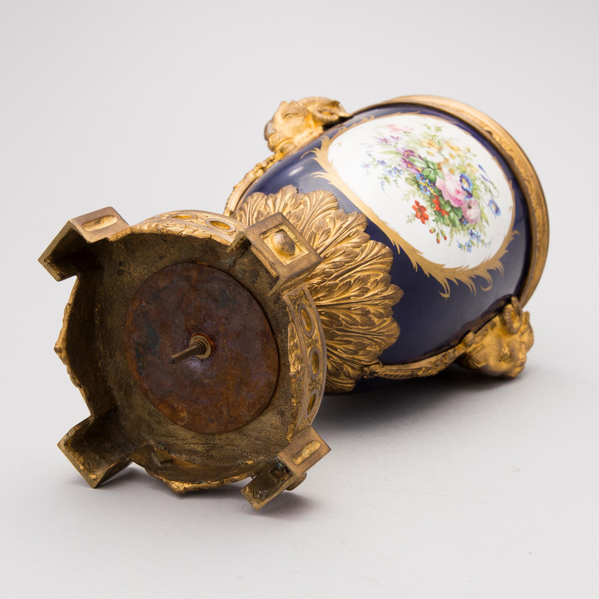 A FRENCH SÈVRES STYLE URN, porcelain and gilt bronze, latter half of the 19th century.
