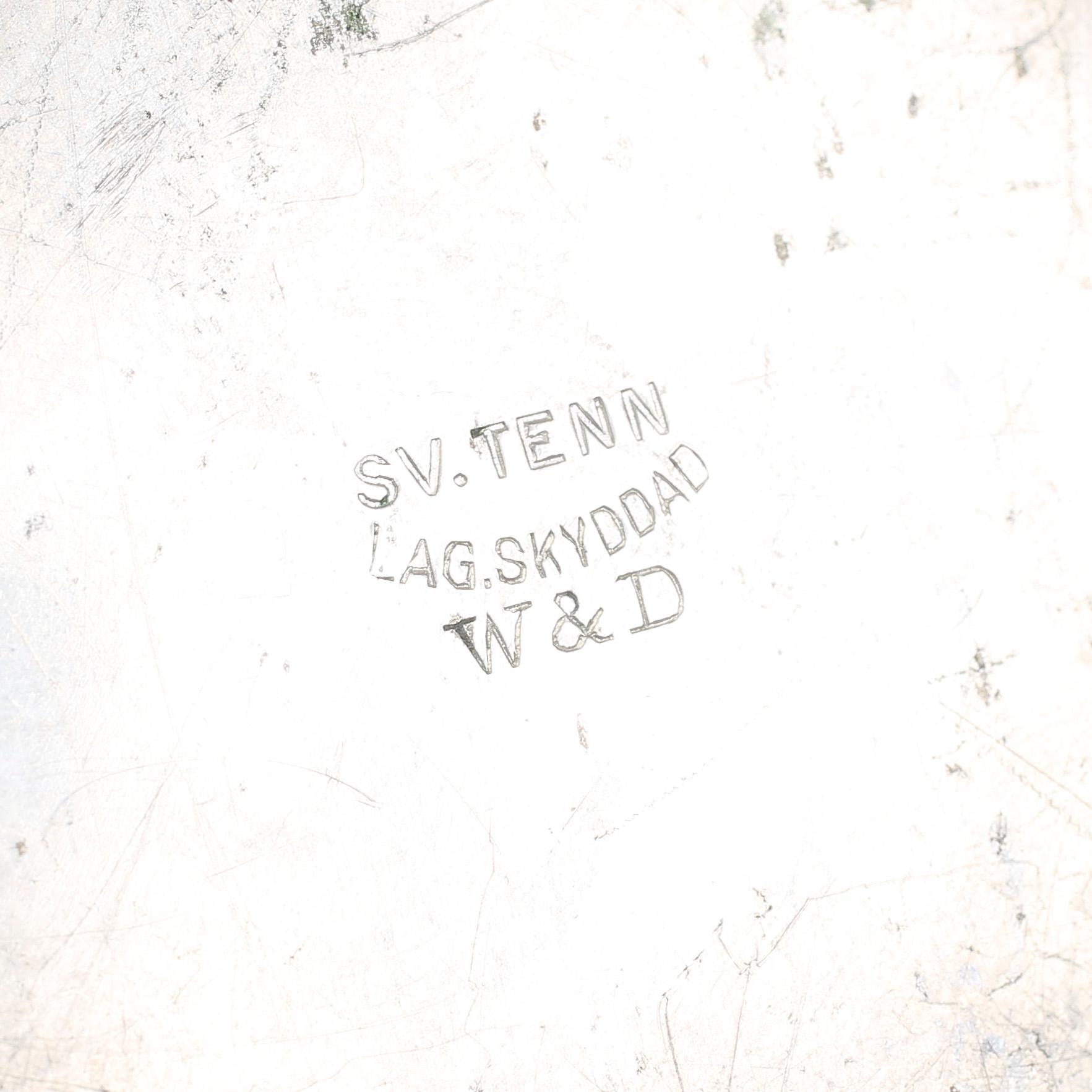 MANSCHETTKNAPPSASK, tenn, "Originell", Widerholm & Dahlberg, Eskilstuna, 1930/40-tal.