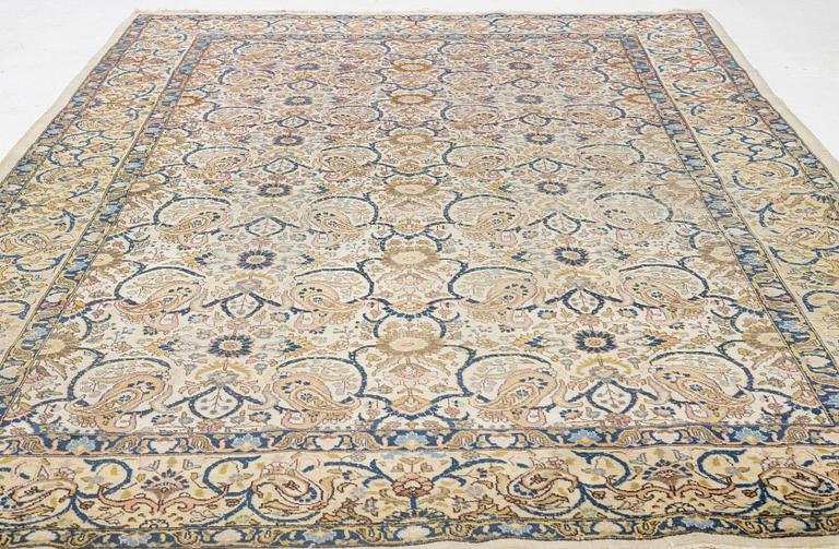 A Tabriz carpet, semi-antique, c. 330 x 230 cm.