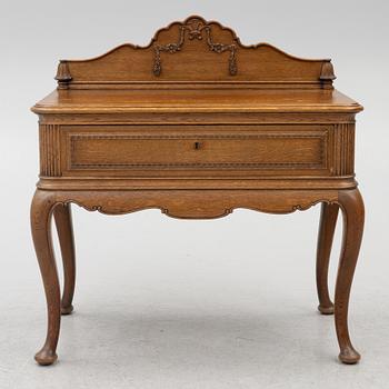 Dining table, 8 chairs, 2 armchairs, sideboard, Rococo style, early 20th century.