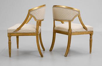 A pair of late Gustavian armchairs.