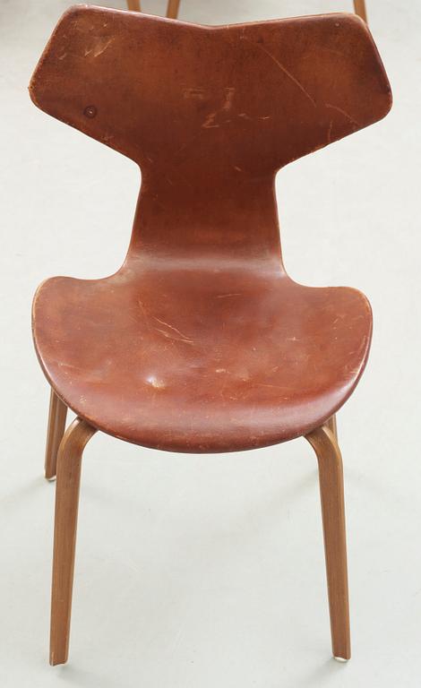 Three Arne Jacobsen teak and brown leather 'Grand Prix' chairs, Fritz Hansen, Denmark 1950's-60's.