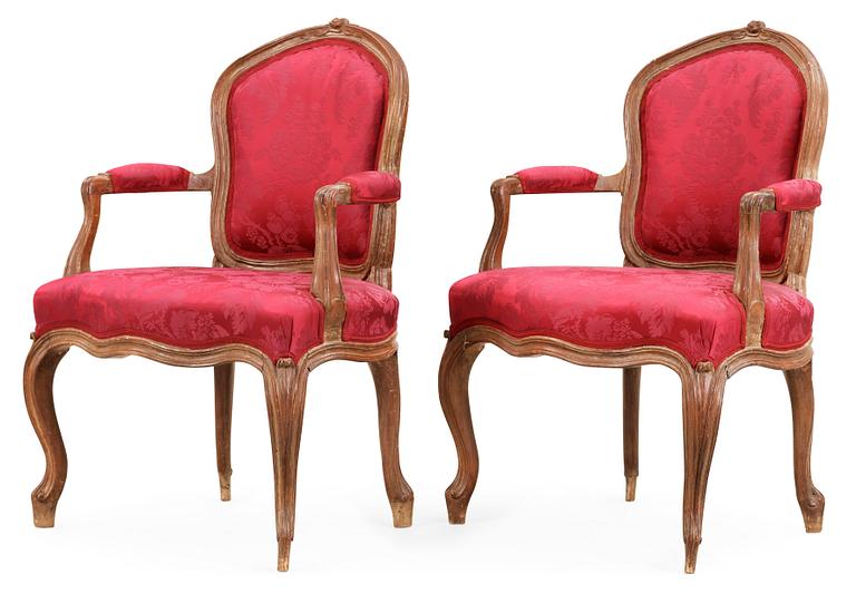 A pair of Rococo 18th century armchairs.