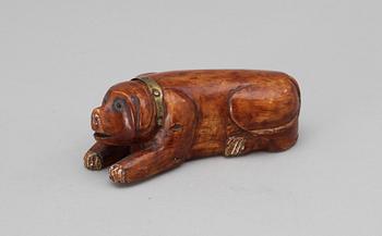 A 19th-20th century birch snuffbox in the shape of a lying dog.