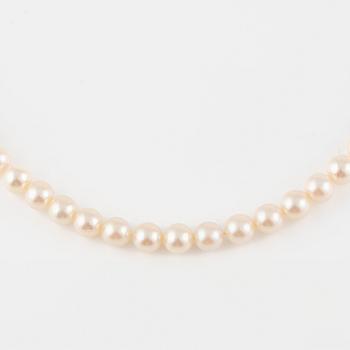 Three strands of cultured pearls, without clasps.