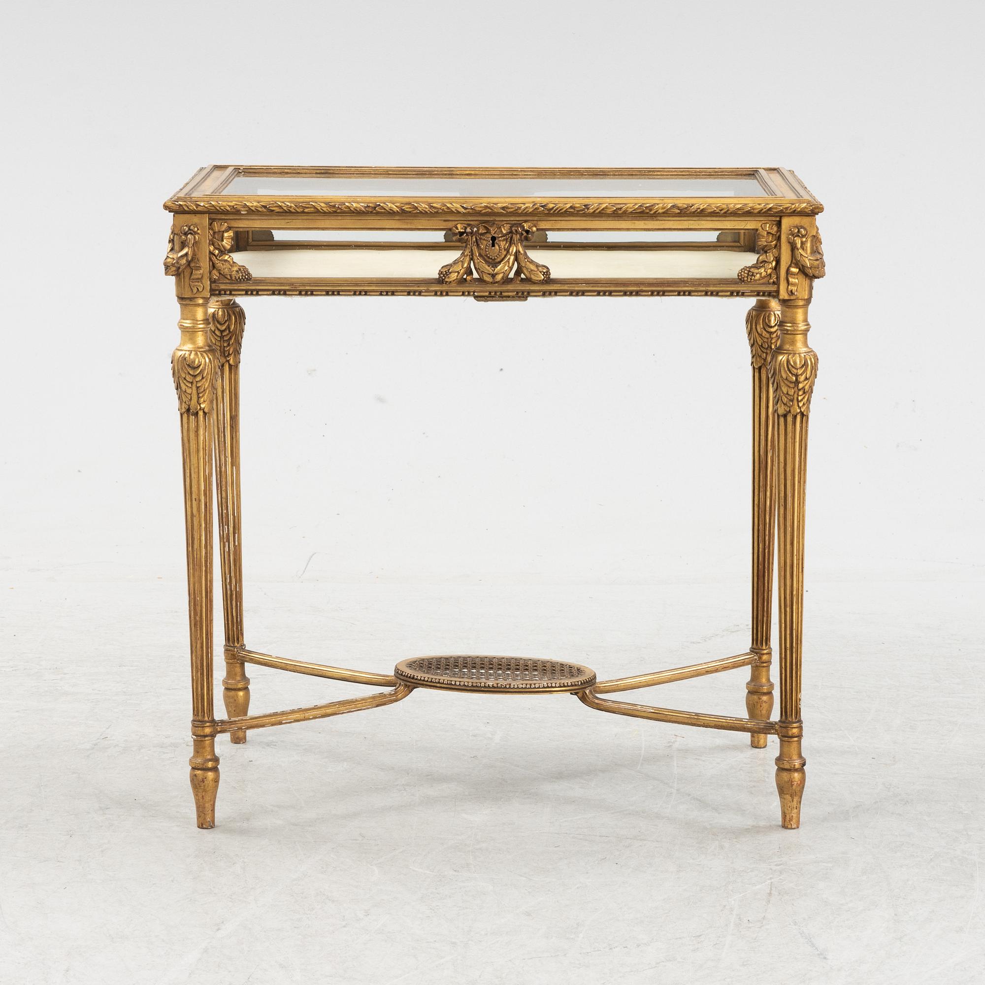 A bronzed display table, early 20th Centiury.