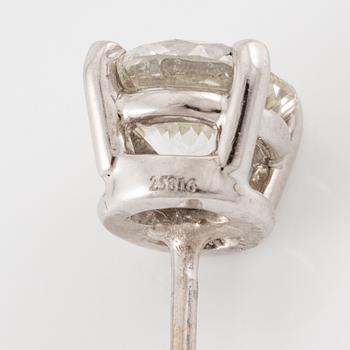 A pair of earrings in 18K white gold set with two round brilliant-cut diamonds, likely Tiffany & Co.