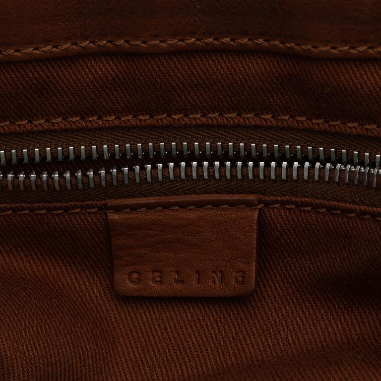 Céline, a leather handbag.