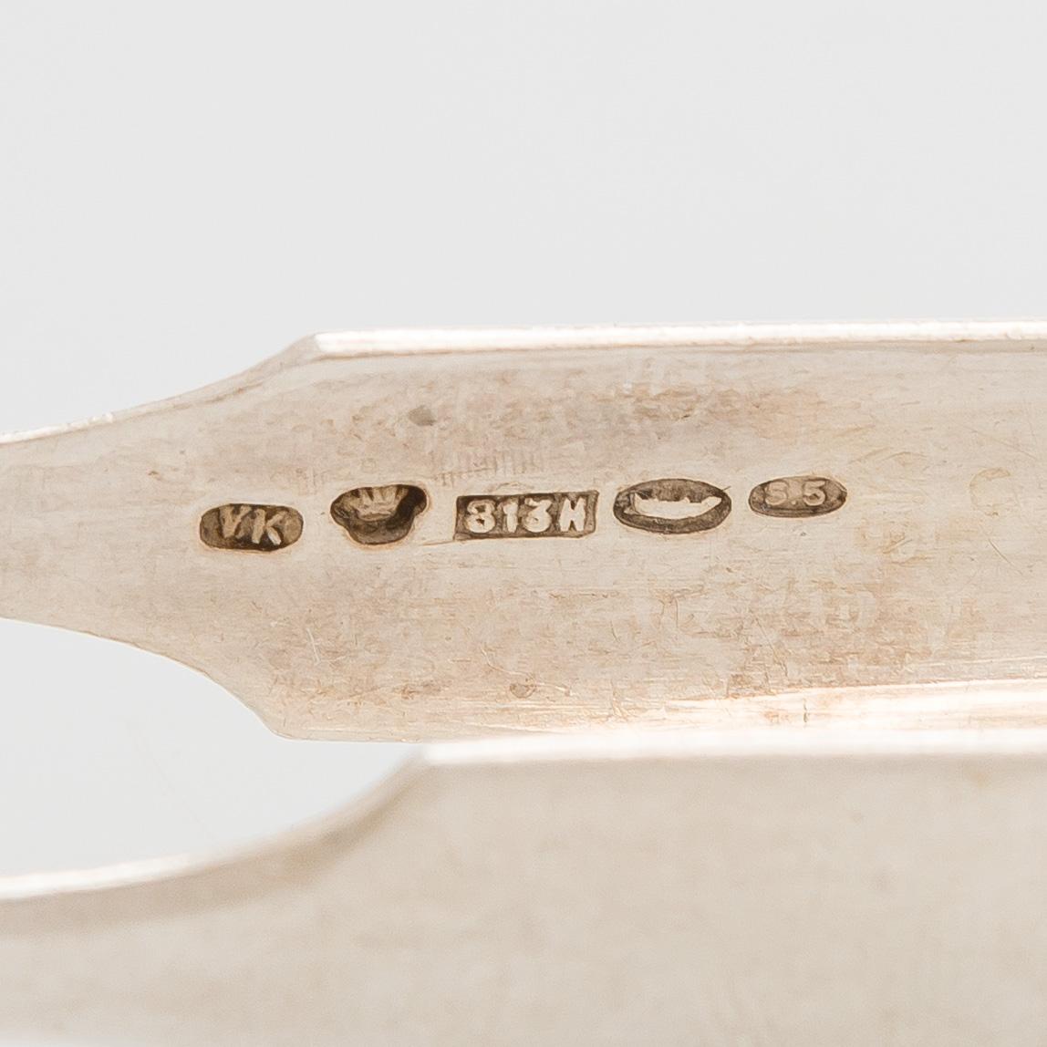 A silver coffee pot, sugar bowl, cream jug, and sugar tongs, Finland 1926-49.