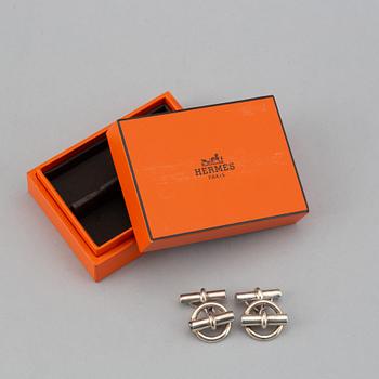 HERMÈS, a pair of silver cuff links.