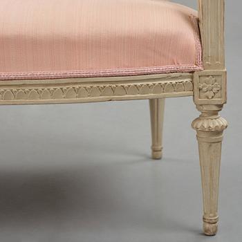 A Gustavian carved sofa, later part of the 18th century.