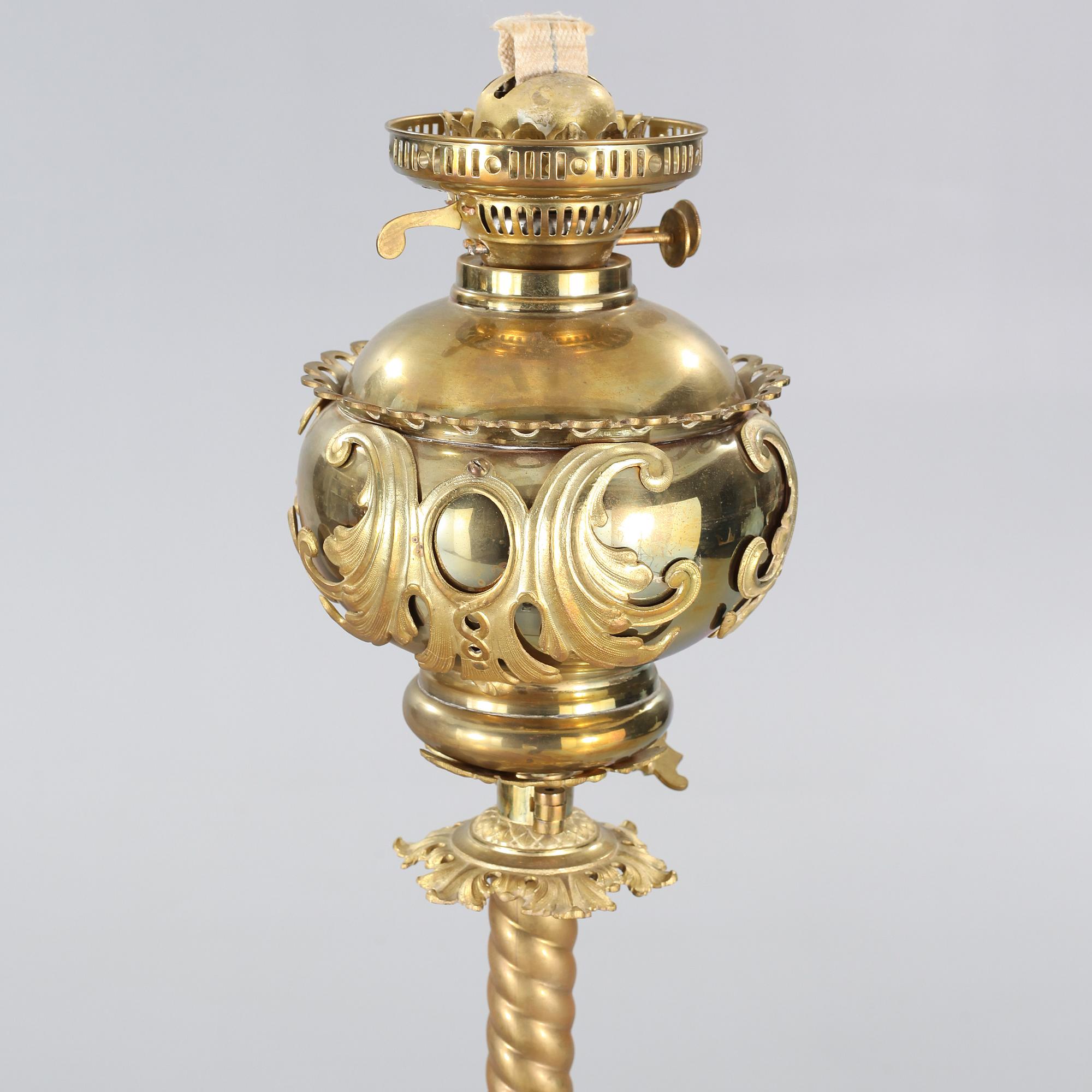 Two floor parafine lamps, 20th century.