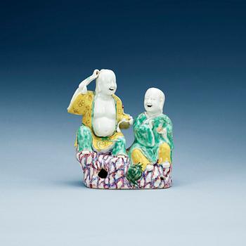 A famille rose figure of laughing boys, Qing dynasty, Qianlong (1736-1795).