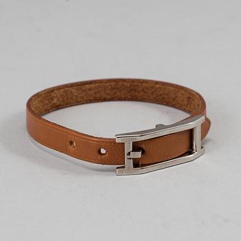 HERMÈS, a scarf and a bracelet.