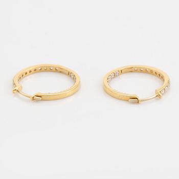 Brilliant cut diamond hoop earrings.