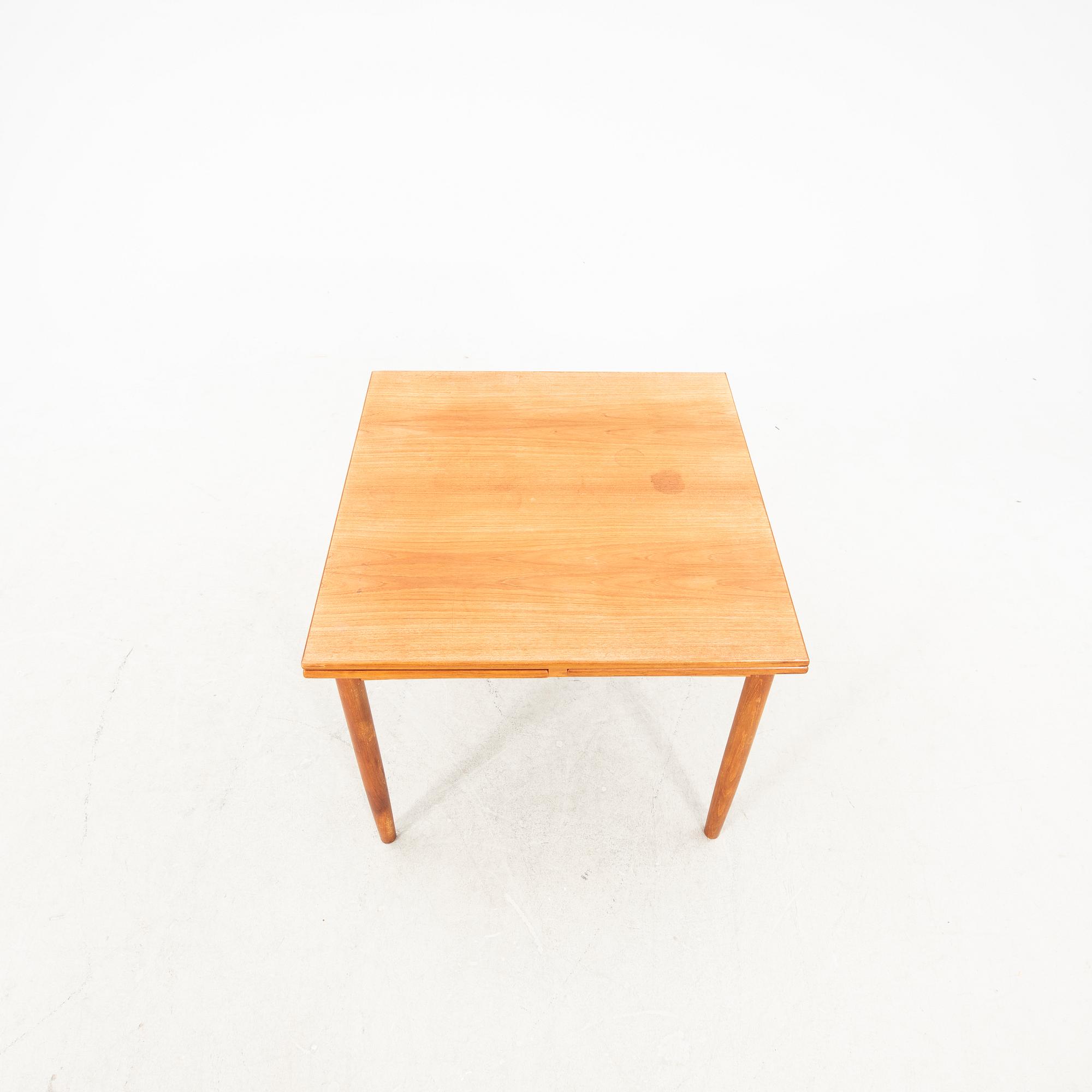 A teak table from the middle of the 20th century.