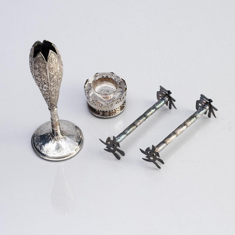 A silver bud vase, two stands for the butter knifve and a salt, China, early 20th Century.