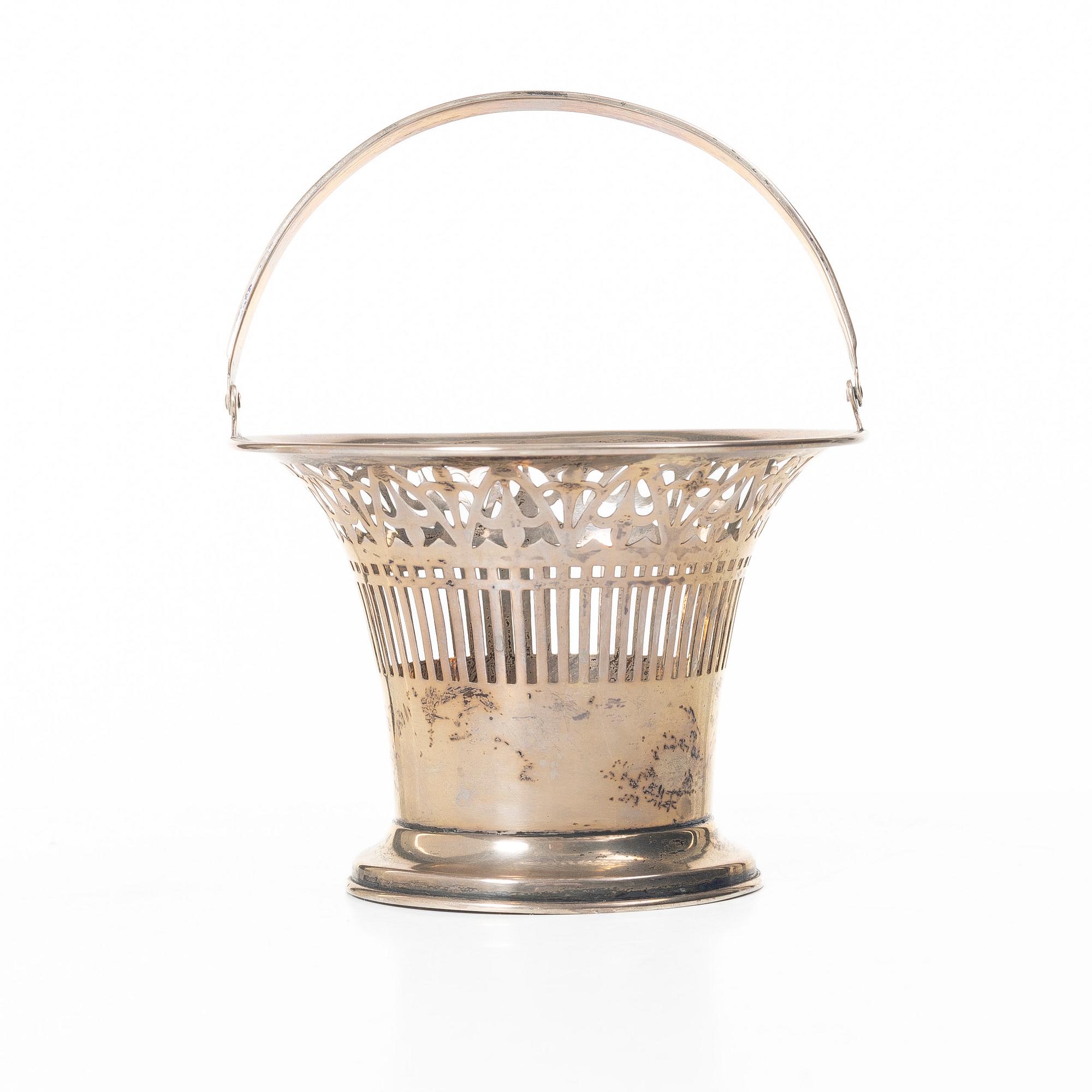 A sterling silver bowl with handle, signed with monogram CMM, 20th century.