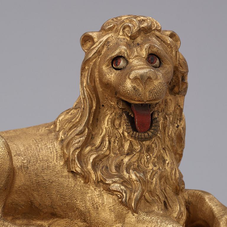 A rare gilt brass on ebonised base Lion Automaton figure clock, Augsburg circa 1630.