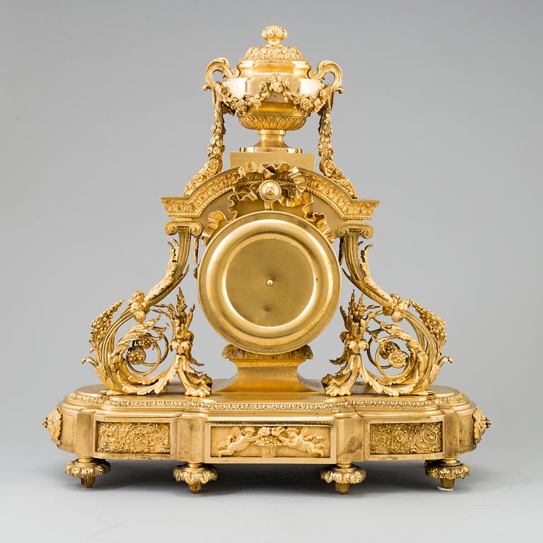 A Louis XVI-style late 19th century gilt bronze mantel clock.