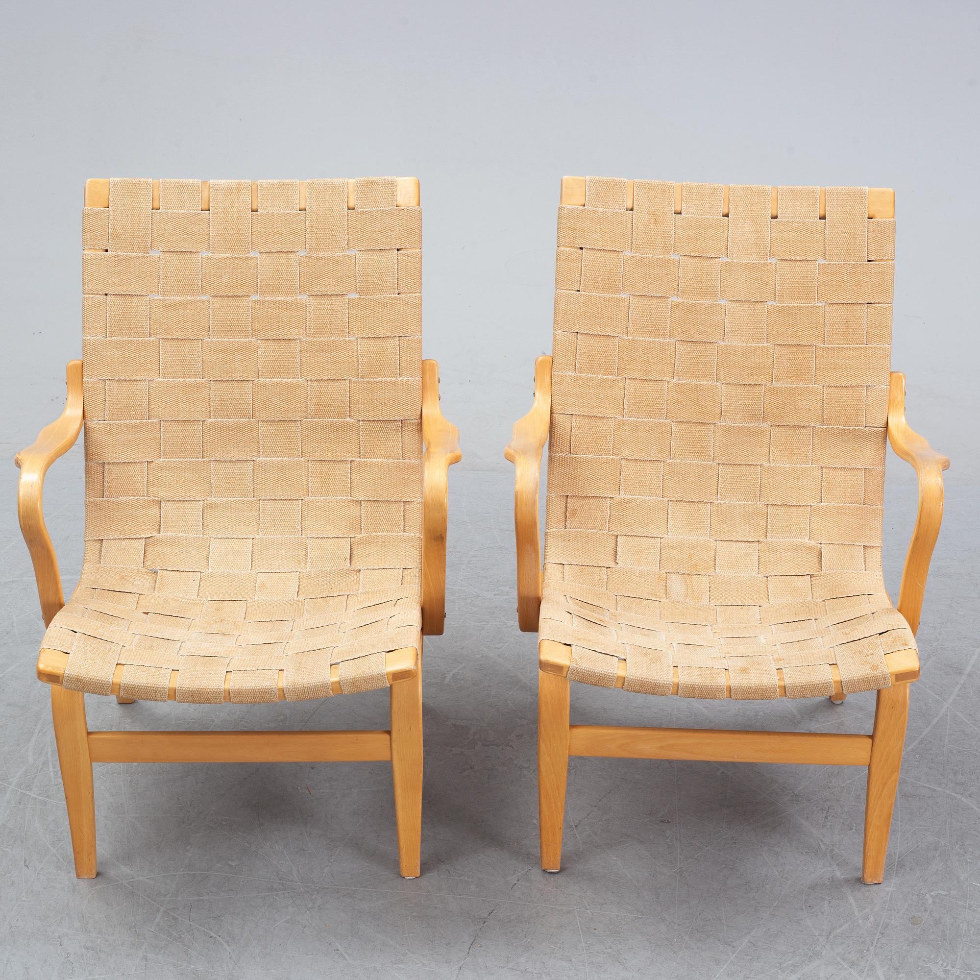 A pair of 'Eva' easy chairs by Bruno Mathsson for Firma Karl Mathsson, dated 1974.