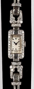 A Patek Philippe ladie's wrist watch, set with baguette- and brilliant cut diamonds, tot. app. 4 cts.