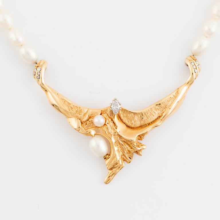 Cultured freshwater pearl necklace, with navette cut diamond and brilliant cut diamonds.