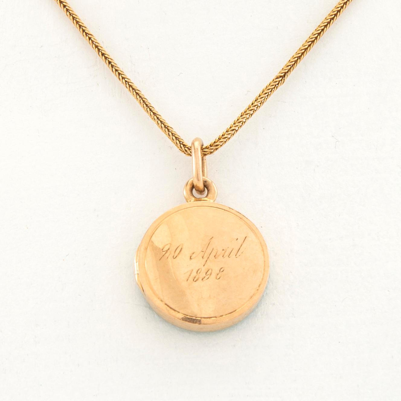 Halsband 18K guld med berlock.