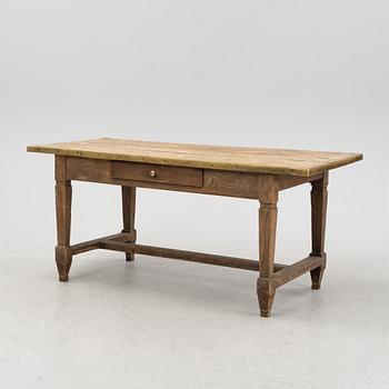 A French oak dining table, 20th Century.