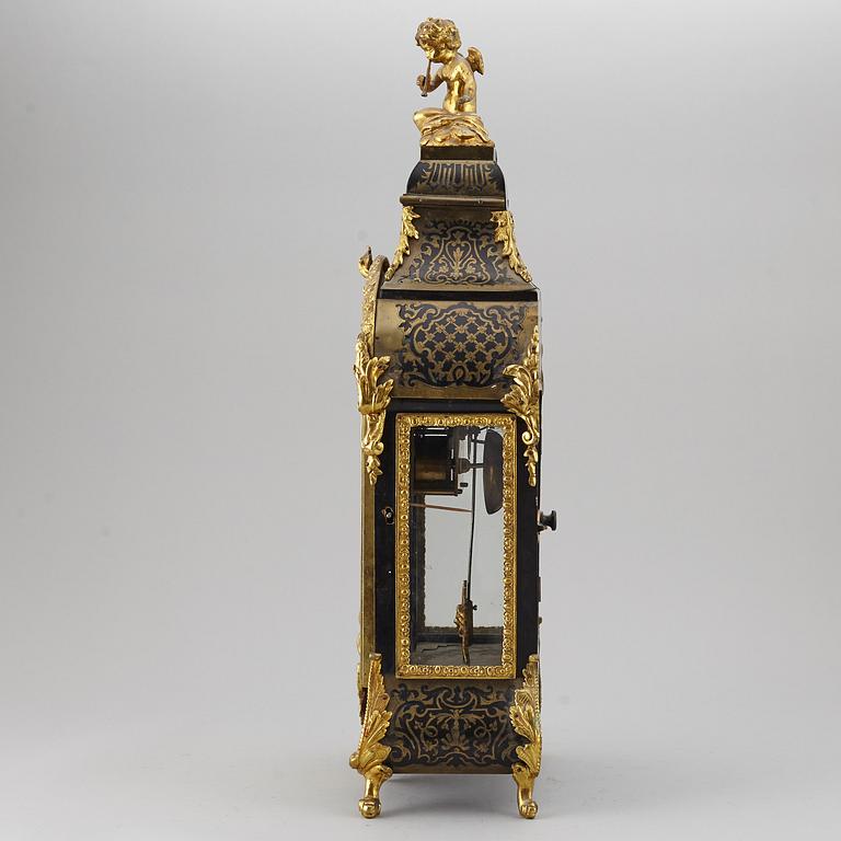 A boulle style table clock, circa 1900.